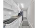 Bright kitchen with modern appliances, white cabinetry, and subway tile backsplash at 1709 S Ocean Blvd. # 403, North Myrtle Beach, SC 29582