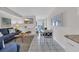 Bright living room with comfortable seating, a dining area, and access to a balcony at 1709 S Ocean Blvd. # 403, North Myrtle Beach, SC 29582