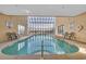 Bright indoor pool with skylight and comfortable seating at 1709 S Ocean Blvd. # 403, North Myrtle Beach, SC 29582