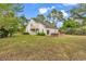 Wide view of house, patio and backyard showing expansive green space at 1729 Longleaf Dr., Myrtle Beach, SC 29575