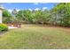 Expansive backyard featuring plenty of green space surrounded by mature trees at 1729 Longleaf Dr., Myrtle Beach, SC 29575