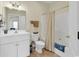 Clean bathroom with a shower-tub combo, white vanity, and tile flooring at 1729 Longleaf Dr., Myrtle Beach, SC 29575