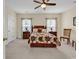 Spacious bedroom featuring a comfortable bed, two windows, and simple decor at 1729 Longleaf Dr., Myrtle Beach, SC 29575