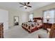 A roomy bedroom with a bed and furnishings and a large wall mirror at 1729 Longleaf Dr., Myrtle Beach, SC 29575
