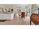 Cozy dining area with chandelier, views of the backyard, and access to the kitchen and living room at 1729 Longleaf Dr., Myrtle Beach, SC 29575