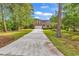 Charming single-Gathering home with brick facade, attached garage, and long private driveway at 1729 Longleaf Dr., Myrtle Beach, SC 29575
