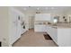 Bright kitchen featuring white cabinets, tile floors, and modern appliances at 1729 Longleaf Dr., Myrtle Beach, SC 29575