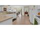 Spacious kitchen with white appliances, tile flooring, and breakfast area with backyard views at 1729 Longleaf Dr., Myrtle Beach, SC 29575
