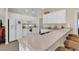 Bright kitchen with white cabinets, countertop bar, and modern appliances at 1729 Longleaf Dr., Myrtle Beach, SC 29575