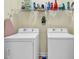 Functional laundry room with washer, dryer, and shelving for storage at 1729 Longleaf Dr., Myrtle Beach, SC 29575