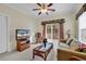 Cozy living room with floral accents, plush sofa, and ample natural light at 1729 Longleaf Dr., Myrtle Beach, SC 29575