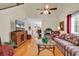 Bright living room featuring hardwood floors, vaulted ceiling, and open layout to the dining area at 1729 Longleaf Dr., Myrtle Beach, SC 29575