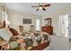 Bright main bedroom with a bed, dresser, and a peek into another room at 1729 Longleaf Dr., Myrtle Beach, SC 29575