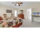 Bright main bedroom features a bed, dresser, and a TV at 1729 Longleaf Dr., Myrtle Beach, SC 29575
