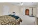 Bright bedroom with neutral walls, ceiling fan, and a seating area for relaxing at 1729 Longleaf Dr., Myrtle Beach, SC 29575