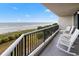 Enjoy ocean views from this beachfront condo balcony with chairs at 200 76Th Ave. N # 301, Myrtle Beach, SC 29572