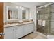 Bright bathroom features a double vanity with granite countertops and a glass door shower at 200 76Th Ave. N # 301, Myrtle Beach, SC 29572