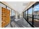 Bright hallway featuring large windows with views, tile floors, and built-in shelving for added convenience at 200 76Th Ave. N # 301, Myrtle Beach, SC 29572