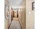 Hallway with neutral paint, carpet, and a shell-encrusted mirror in a well-maintained home at 200 76Th Ave. N # 301, Myrtle Beach, SC 29572
