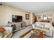 The living area showcases a large television, comfortable seating, and an adjacent dining area at 200 76Th Ave. N # 301, Myrtle Beach, SC 29572
