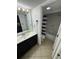 Bathroom with a dark vanity, a mirror, and a shower tub with a striped shower curtain at 200 76Th Ave. N # 608, Myrtle Beach, SC 29572