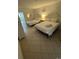 Bright bedroom featuring two queen beds with white linens, tiled floors, and access to the balcony at 200 76Th Ave. N # 608, Myrtle Beach, SC 29572