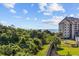 Scenic view showcasing the building, surrounding lush greenery, and the ocean in the distance at 200 Lands End Blvd. # 3015, Myrtle Beach, SC 29572
