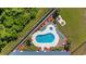 Aerial view of pool, jacuzzi, palm trees, lounge chairs, and landscaping at 200 Lands End Blvd. # 3015, Myrtle Beach, SC 29572