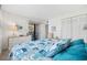 Comfortable bedroom with a view of the balcony, ample natural light, white dresser and closet at 200 Lands End Blvd. # 3015, Myrtle Beach, SC 29572