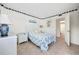Charming bedroom with nautical decor, a white wicker headboard, and view of the bathroom at 200 Lands End Blvd. # 3015, Myrtle Beach, SC 29572