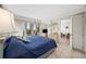 Bedroom with balcony access, TV, dressers and ensuite bathroom at 200 Lands End Blvd. # 3015, Myrtle Beach, SC 29572