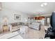 Bright living room featuring neutral tile floors, light walls and comfortable seating with a view into the kitchen at 200 Lands End Blvd. # 3015, Myrtle Beach, SC 29572
