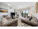 Comfortable living room featuring a large TV and a sliding glass door leading to a balcony with nice scenery at 200 Lands End Blvd. # 3015, Myrtle Beach, SC 29572