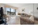 Relaxing living room with sliding doors providing access to the balcony and bringing in plenty of natural light at 200 Lands End Blvd. # 3015, Myrtle Beach, SC 29572