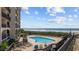 Community pool with lounge chairs and a wooden deck overlooking the ocean at 200 Lands End Blvd. # 3015, Myrtle Beach, SC 29572