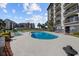 Community pool with lounge chairs, offering a relaxing and inviting atmosphere for residents at 200 Lands End Blvd. # 3015, Myrtle Beach, SC 29572