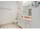 Bright bathroom features a granite countertop vanity and decorative nautical elements on the walls at 209 75Th Ave N # T-8, Myrtle Beach, SC 29572