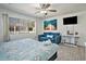 Bright bedroom with waterfront art, a comfortable sofa, and a scenic window view at 209 75Th Ave N # T-8, Myrtle Beach, SC 29572