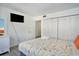 Bedroom featuring ample closet space, a television, and a comfy bed with decorative pillows at 209 75Th Ave N # T-8, Myrtle Beach, SC 29572