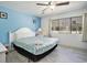Inviting bedroom with a ceiling fan, a comfortable bed, and a bright window view at 209 75Th Ave N # T-8, Myrtle Beach, SC 29572