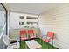 Cozy covered patio features artificial turf and seating, perfect for outdoor relaxation at 209 75Th Ave N # T-8, Myrtle Beach, SC 29572