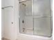 Shower features a frosted sliding glass door and sleek fixtures at 209 75Th Ave N # T-8, Myrtle Beach, SC 29572
