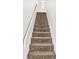 Carpeted staircase with white railings leading to the upper level at 209 75Th Ave N # T-8, Myrtle Beach, SC 29572