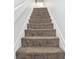 Carpeted stairway leading to the upper levels, offering comfortable access at 209 75Th Ave N # T-8, Myrtle Beach, SC 29572
