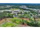 Aerial view of a neighborhood near a golf course, featuring a home with a detached garage at 215 Lander Dr., Conway, SC 29526