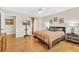 Bright bedroom boasts hardwood floors, neutral walls, and a large window at 215 Lander Dr., Conway, SC 29526