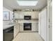 Efficient kitchen design with white cabinets and appliances maximizes space and functionality at 215 Lander Dr., Conway, SC 29526
