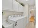 Laundry room with abundant storage cabinets that are perfect for organization and convenience at 215 Lander Dr., Conway, SC 29526