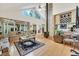 Bright living room with hardwood floors, vaulted ceilings, and a decorative fireplace at 215 Lander Dr., Conway, SC 29526