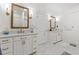 Bathroom with double vanity, marble floors, and decorative mirrors create a spa-like atmosphere at 2180 Waterview Dr. # 1044, North Myrtle Beach, SC 29582